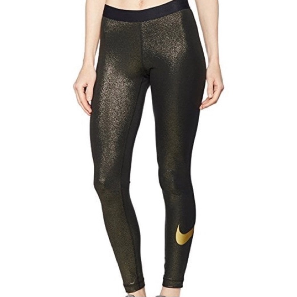 Gold and black Nike leggings! The tag is cut off but they are an xs.